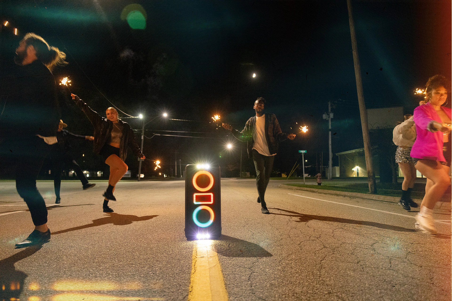 Klipsch Party Speakers Vibe friends running down street with sparklers in hand 2000x1333